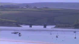 View of St Issey from the Camel Estuary, with the Camel Trials Iron footpath/cycle bridge, linking Padstow to Wadebridge.